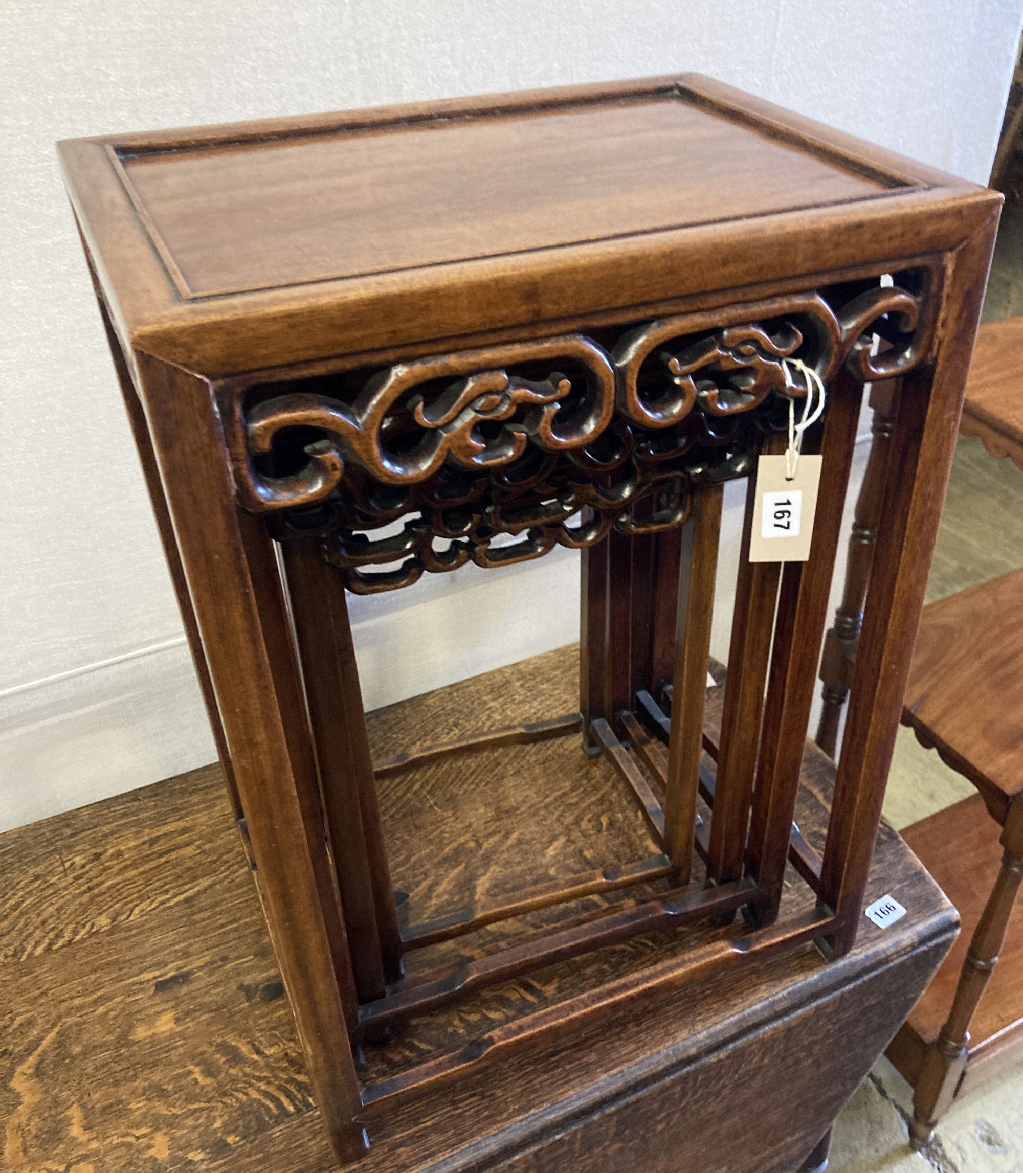 A nest of four Chinese carved hardwood tea tables, width 44cm, depth 33cm, height 62cm